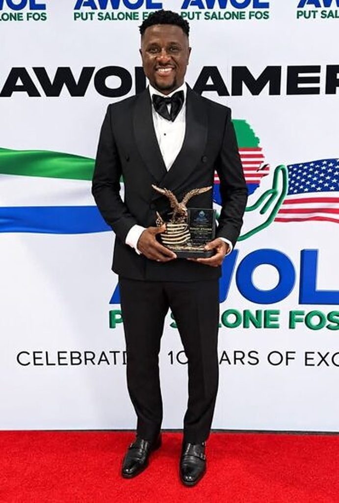 An award recipient poses with his trophy