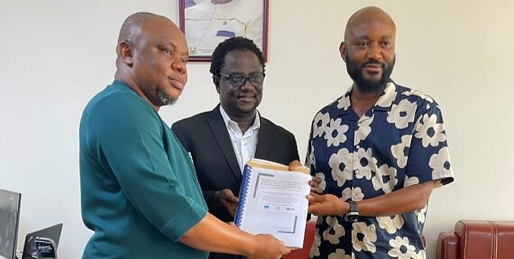 MRCG National Coordinator Dr Francis Sowa presents the reform package to Deputy Minister Bockarie Aziz Bawoh